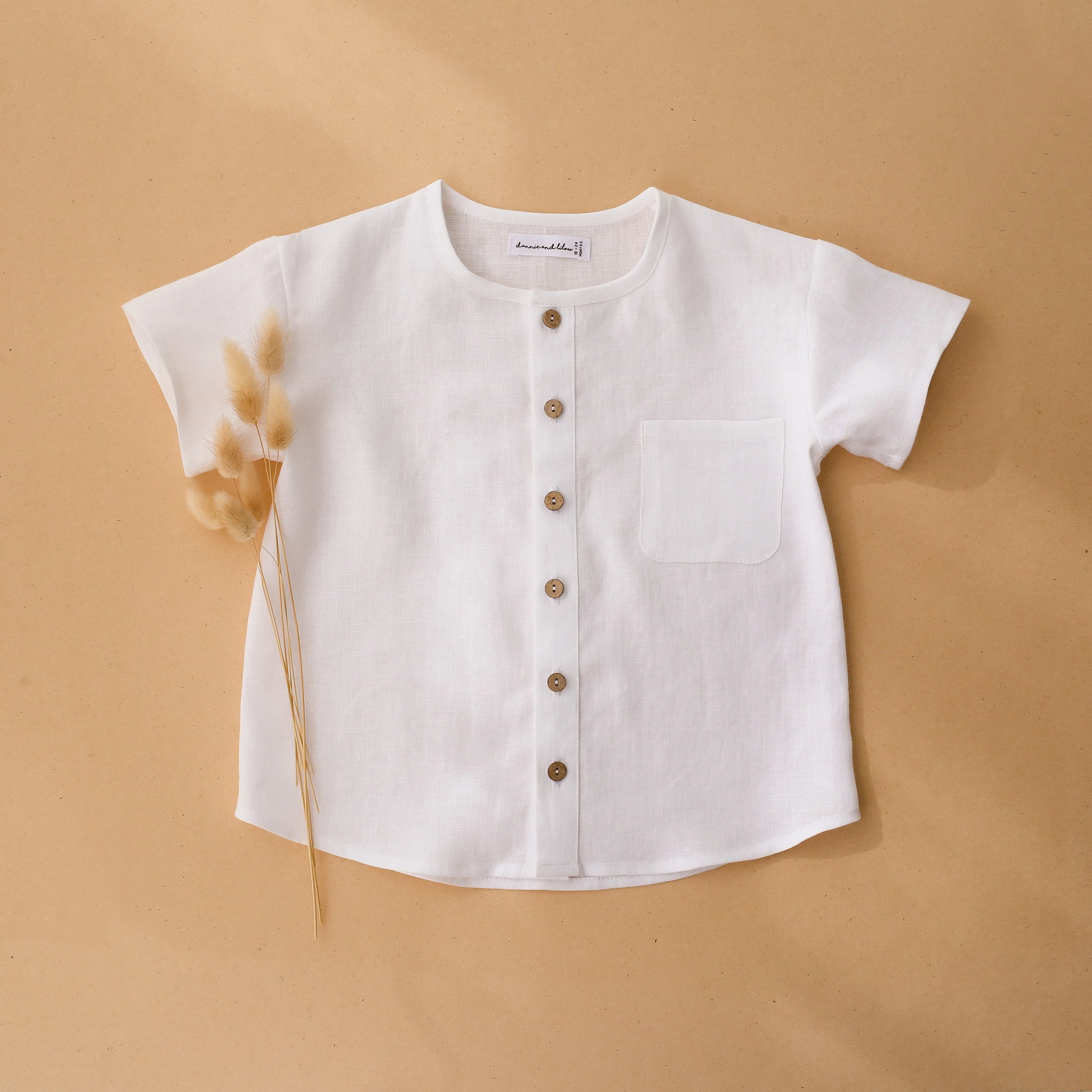 White Linen Short Sleeve Buttoned Top with Curved Hemline
